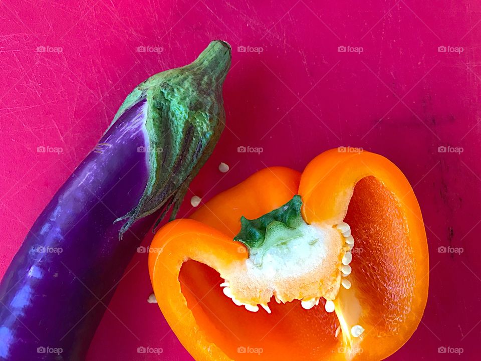 Orange bell pepper and eggplant with copy space