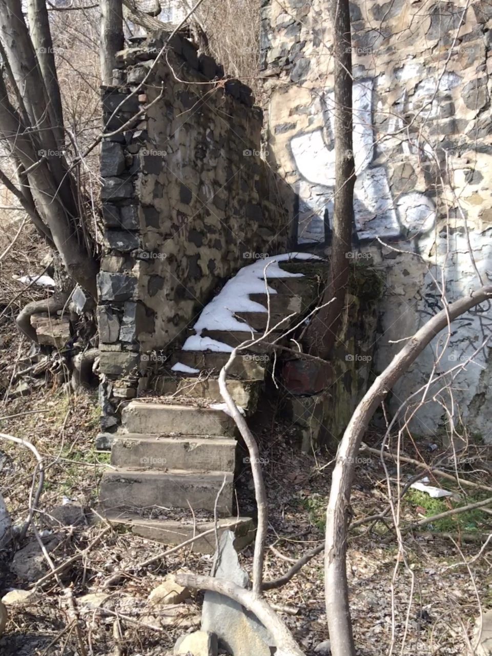 Snow on stairs with graffiti
