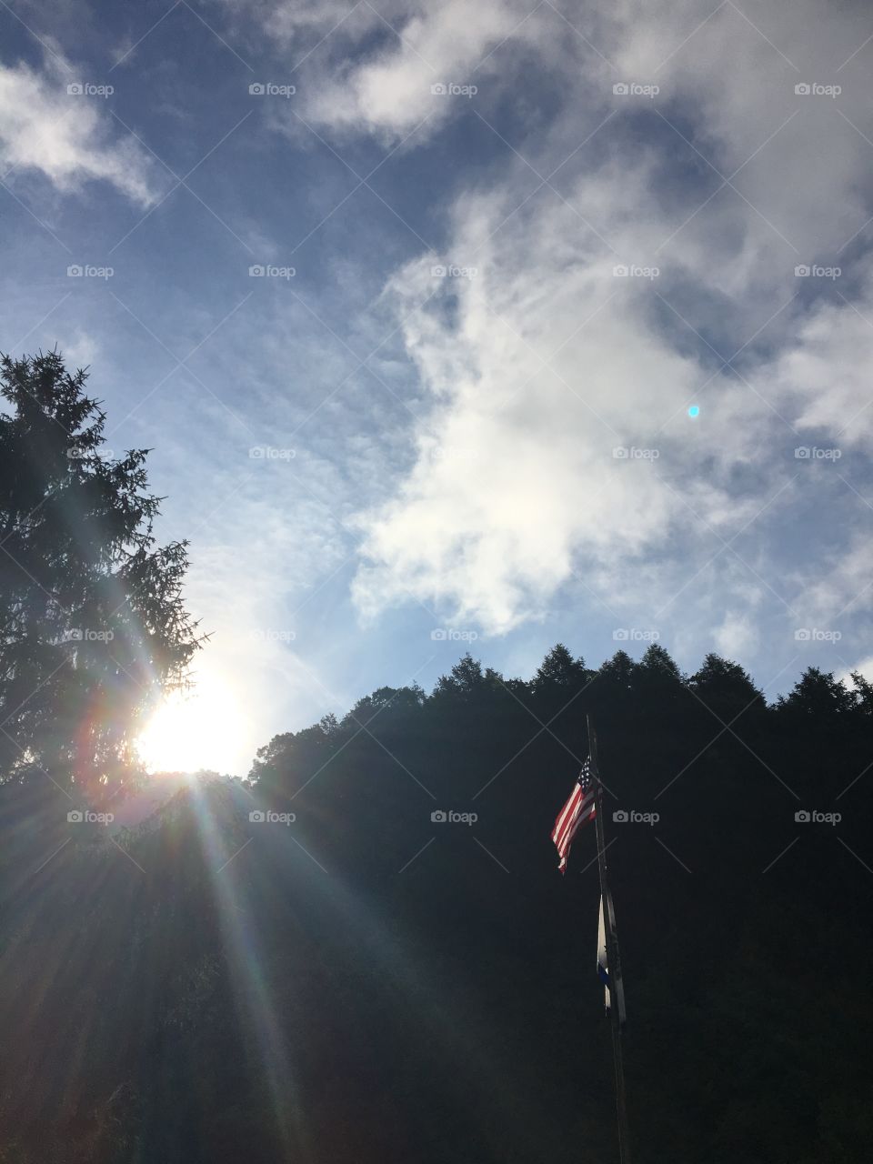 Flag at sunrise in the mountains 