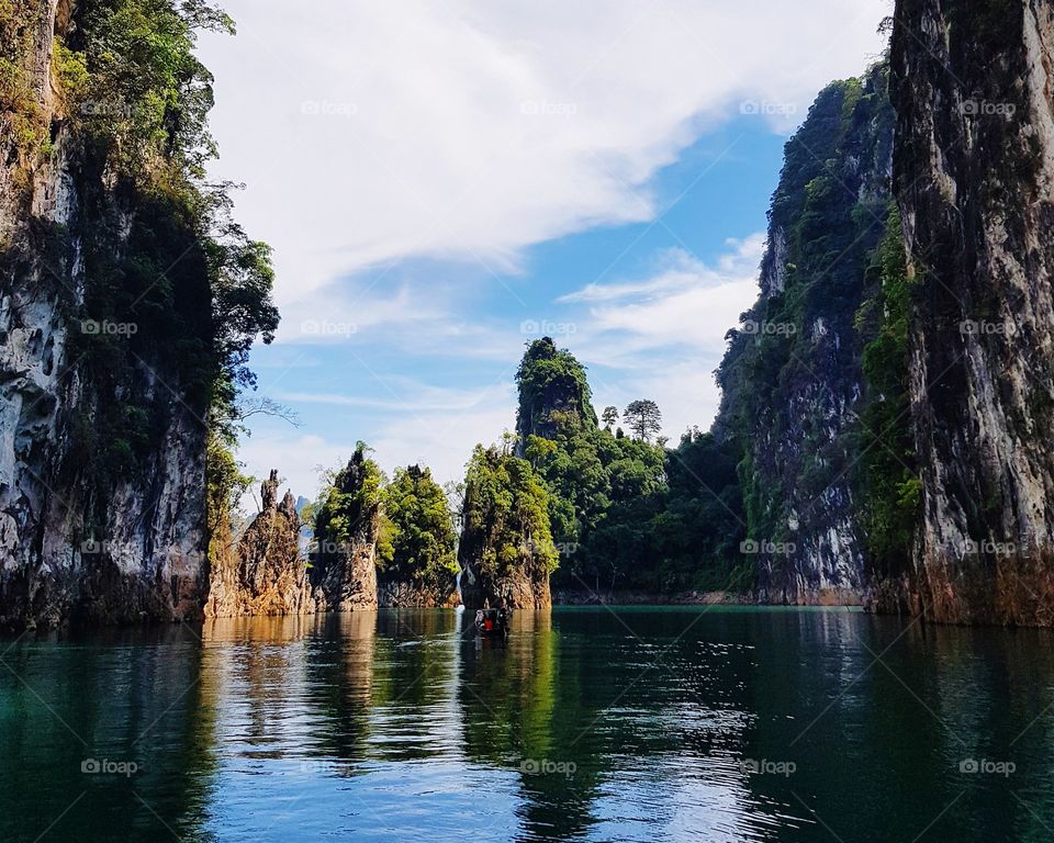 Scenic view of lake and limestone mountains