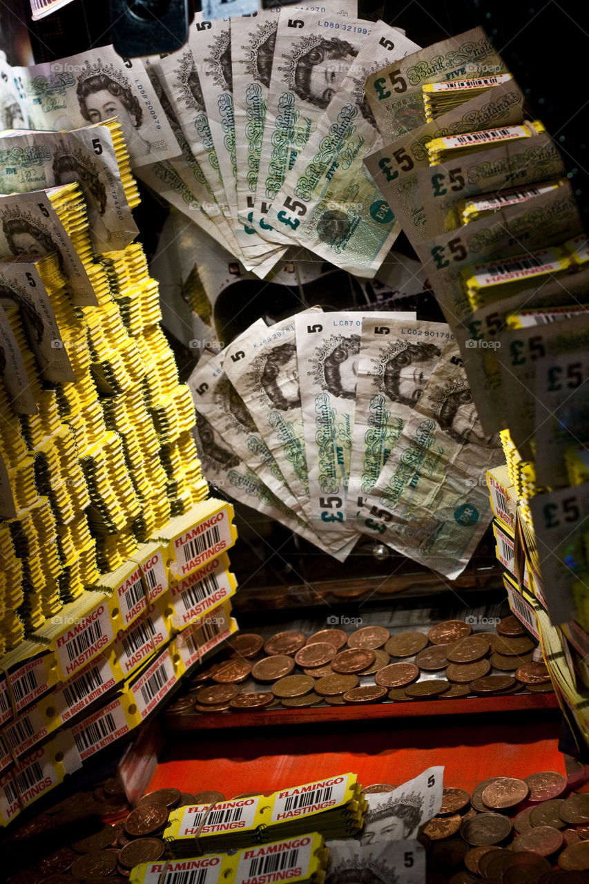 Looking into an amusement arcade machine offering cash prizes and tokens 