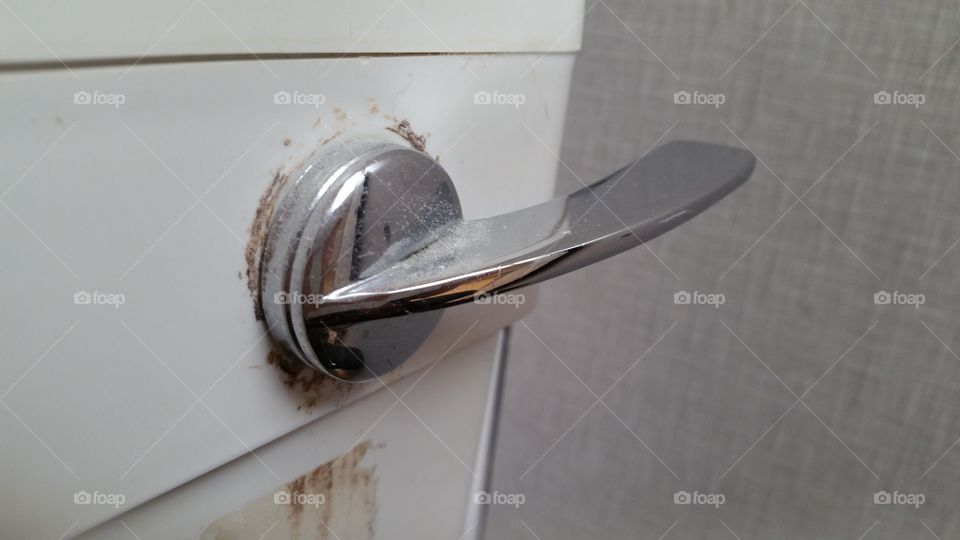 grubby industrial toilet flush handle