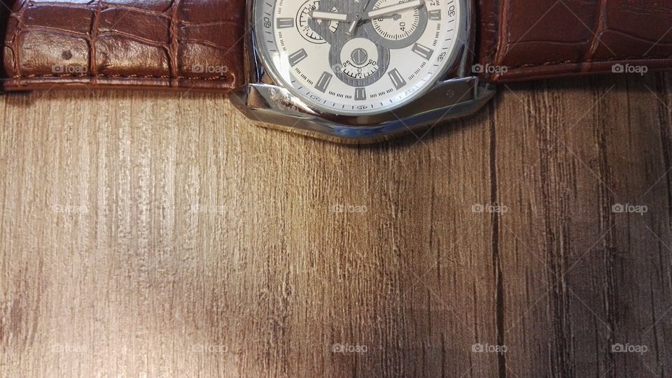 elegant watch on a wooden background