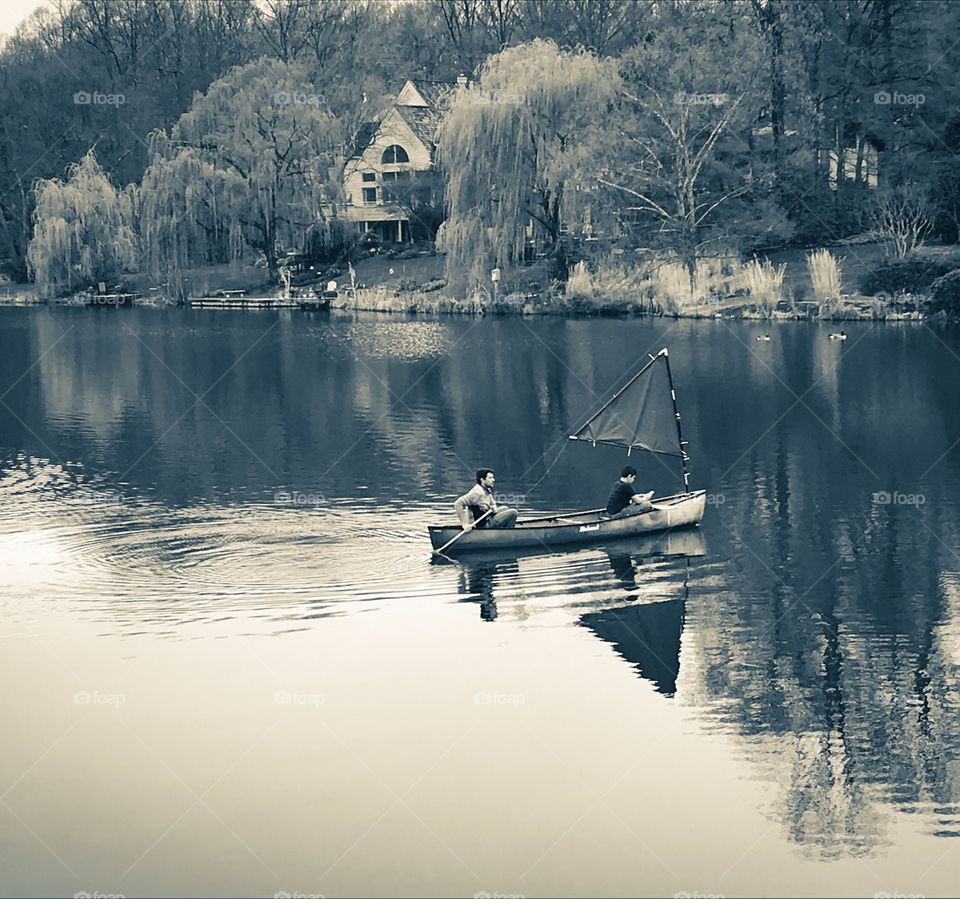Father and Son canoeing on the lake 