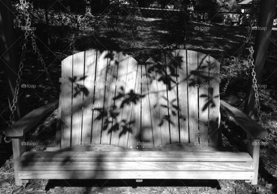 Backyard swing with shadows