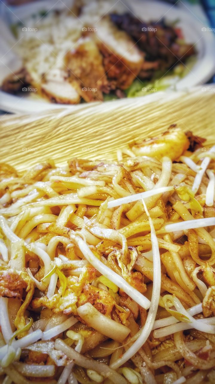 Stir fried rice noodles with bean sprouts and fresh shrimp. A wonderful Asian food delight.