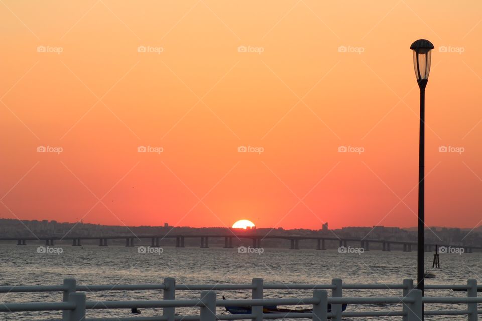 Ocean sunset watched at the pier 