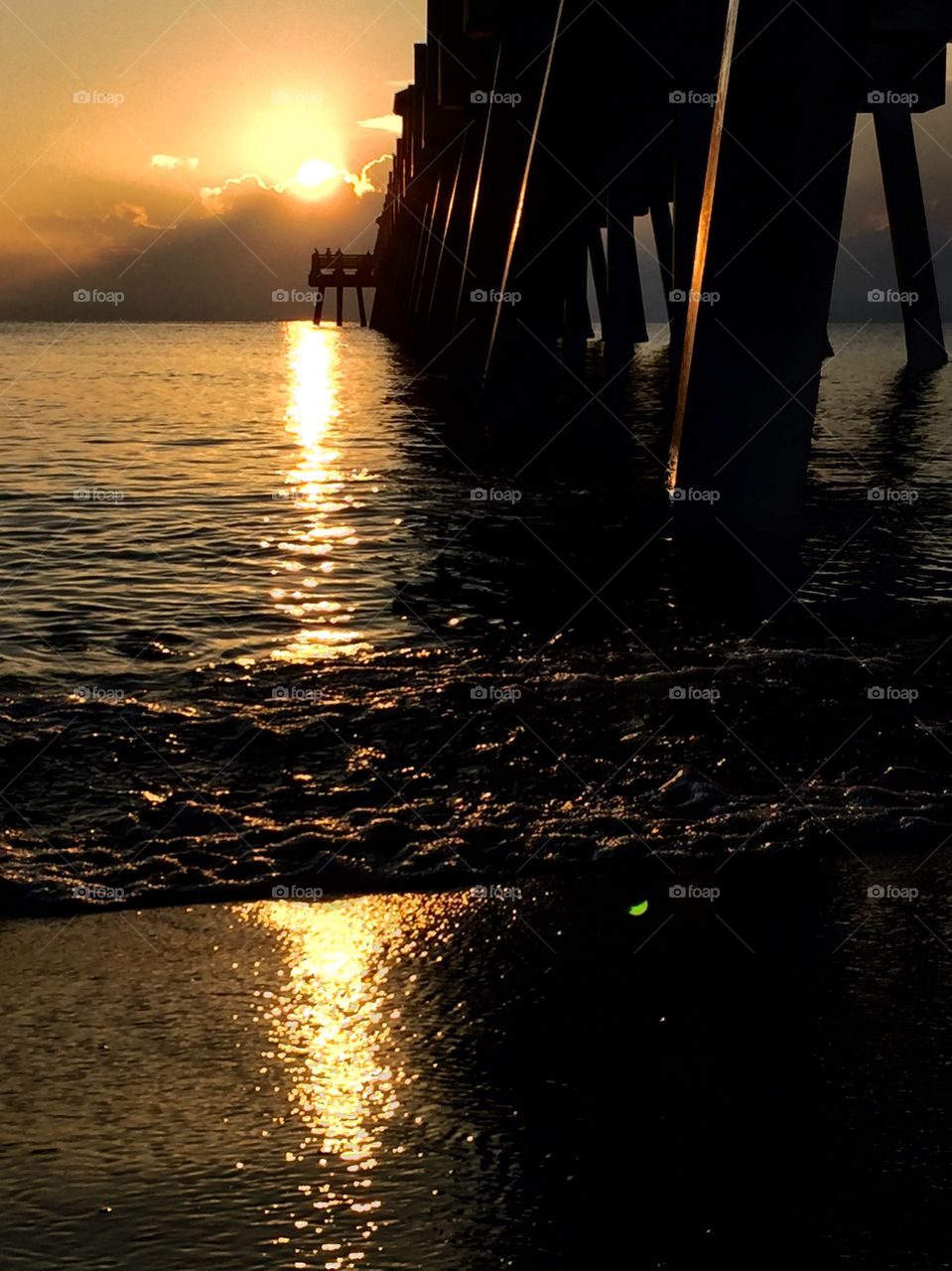 This was taken during sunrise underneath the Jupiter pier.  An amazing array of gold gave an unforgettable start to an amazing day.