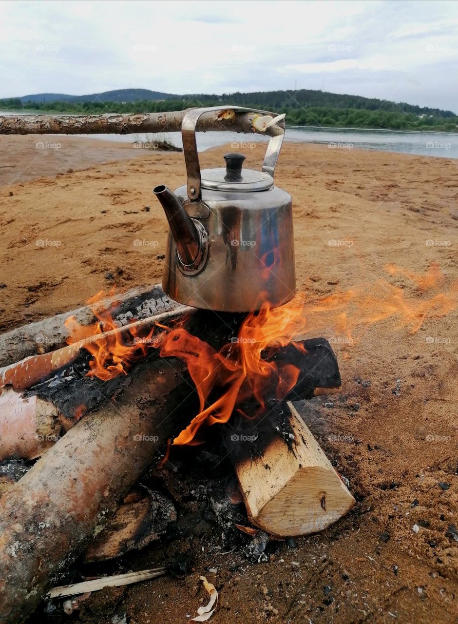 Soot pan coffees on the shore of Tornio river in Finnish Lapland during the summer.