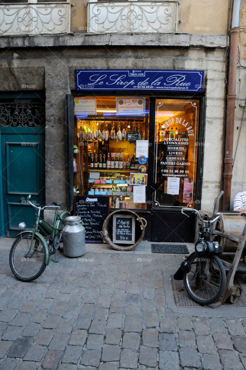 Small souvenir shop on a cobblestone street in France