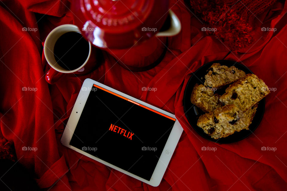 Netflix flat lay with coffee and biscuits cosy in winter