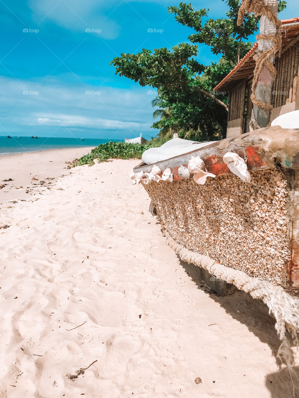 Beautiful decorated boat and a beautiful beach in red crown Bahia Brazil