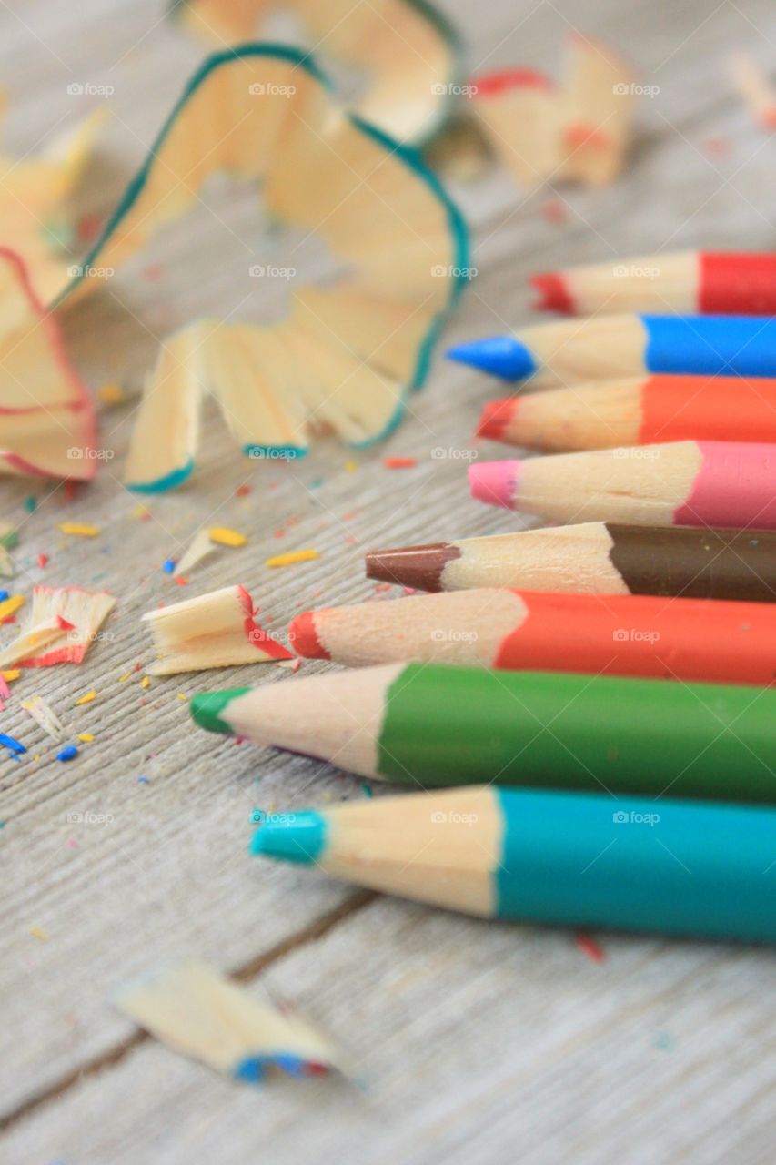 Colored pencils in a row