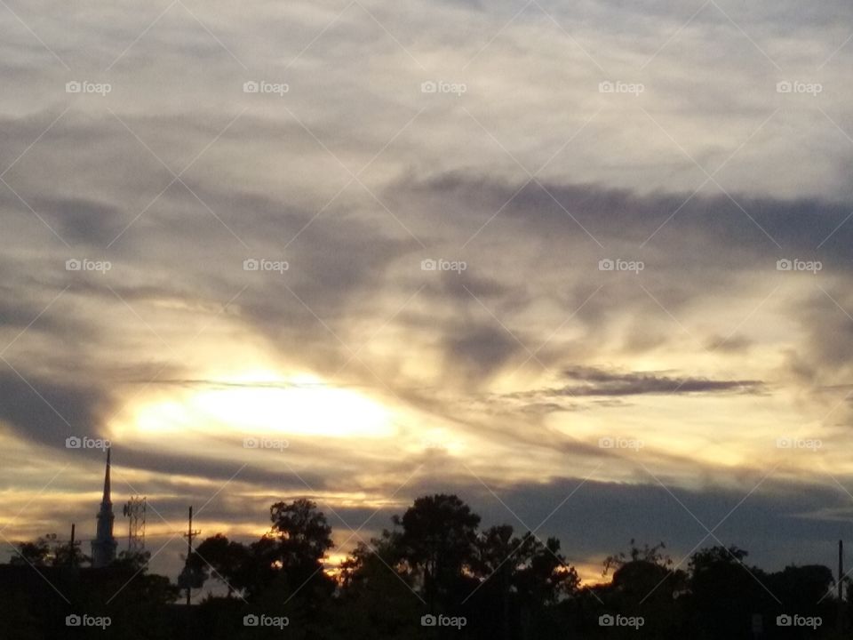 Silhouette of tree against dramatic sky