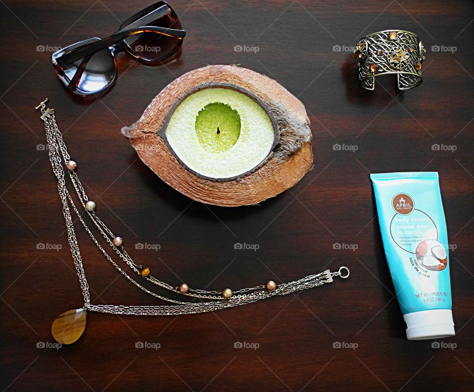 Jewelry, a Citronella candle and lotion.