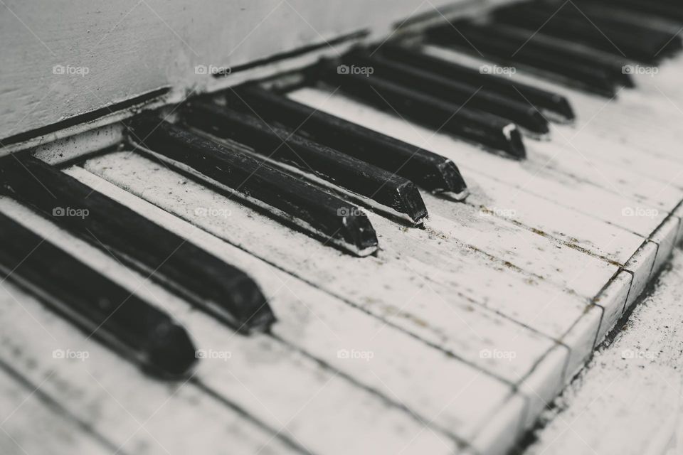 Row of piano keys.  Background of retro piano details , close up view