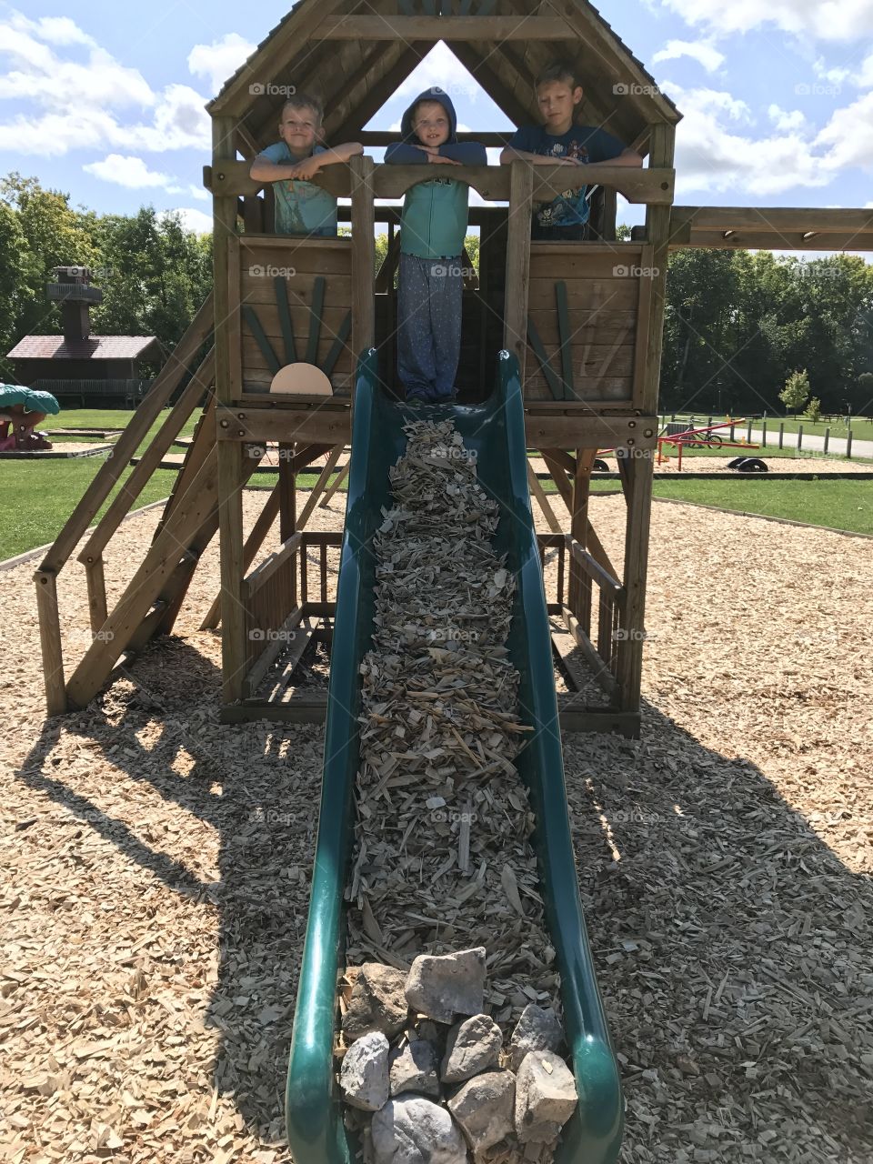 Filling he slide with wood chips