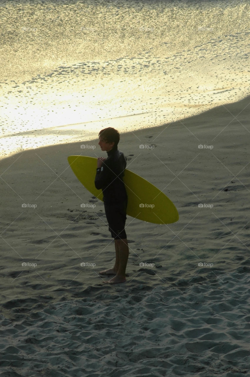 Surfer. Silhouette of a surfer at Sunset