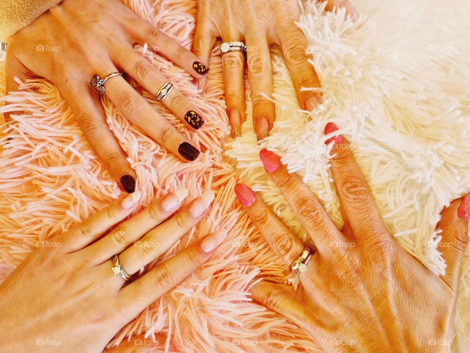 top view of hands with manicure and semi-permanent