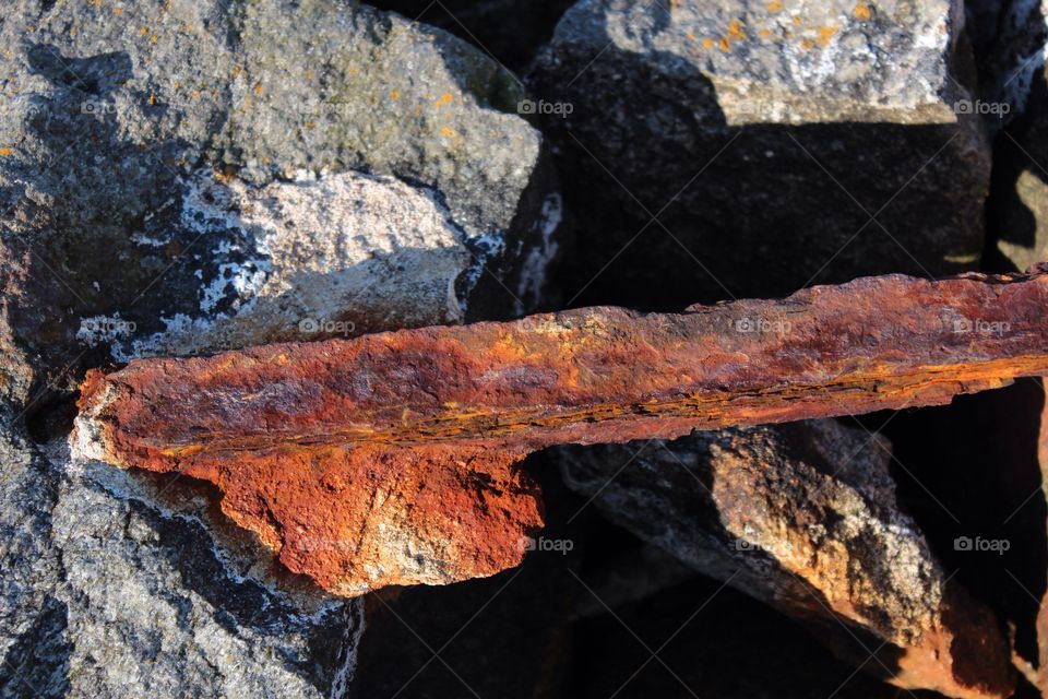 Rusty object on stone