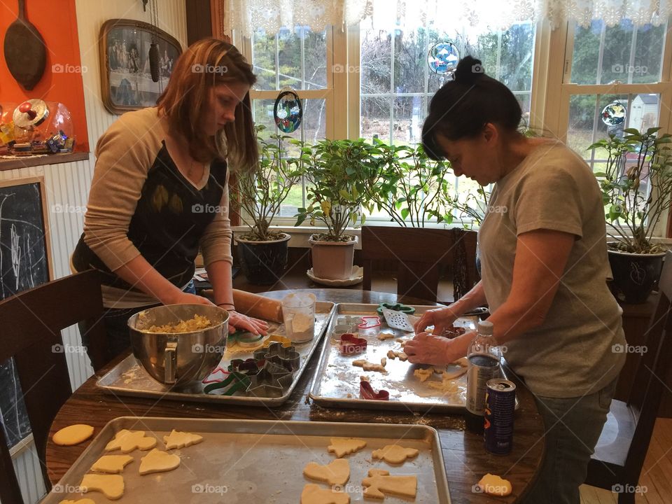 Woman making christmas cookies in the kitchen