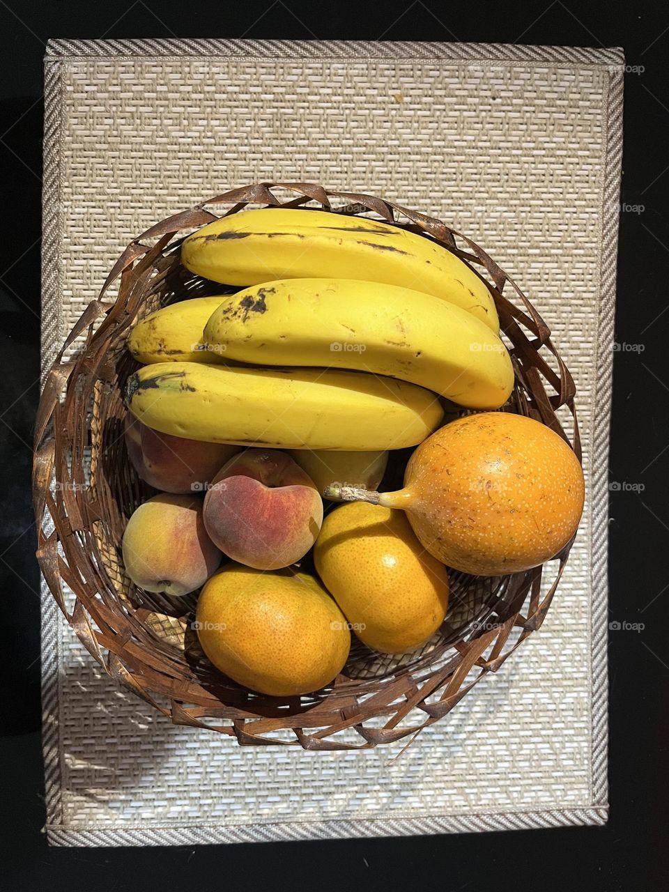 Yellow fruits into a circle basket