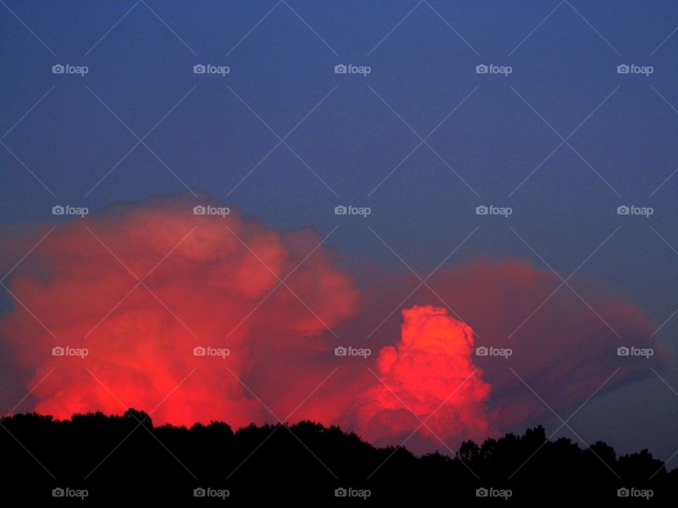 Red evening luminary thunderheads in Jewett Ohio 