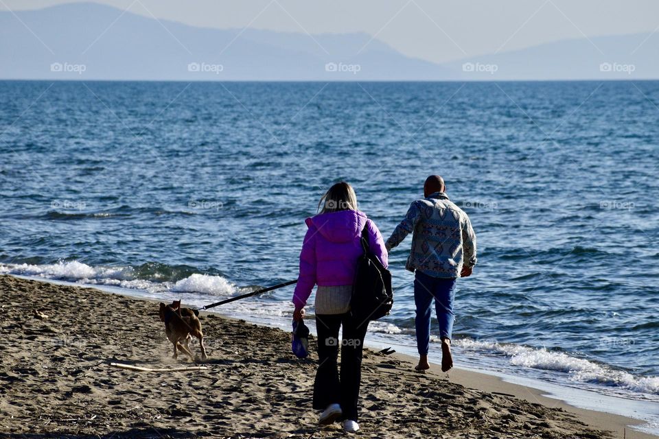 People on a walk with dog