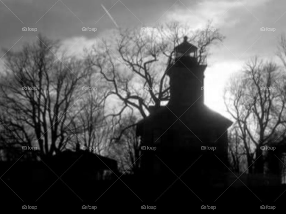 Old Lighthouse. This is the original lighthouse at Sodus Point, in western New York State. Though its duties have been taken over by a newer modern tower, the old structure remains, keeping watch over the bay.