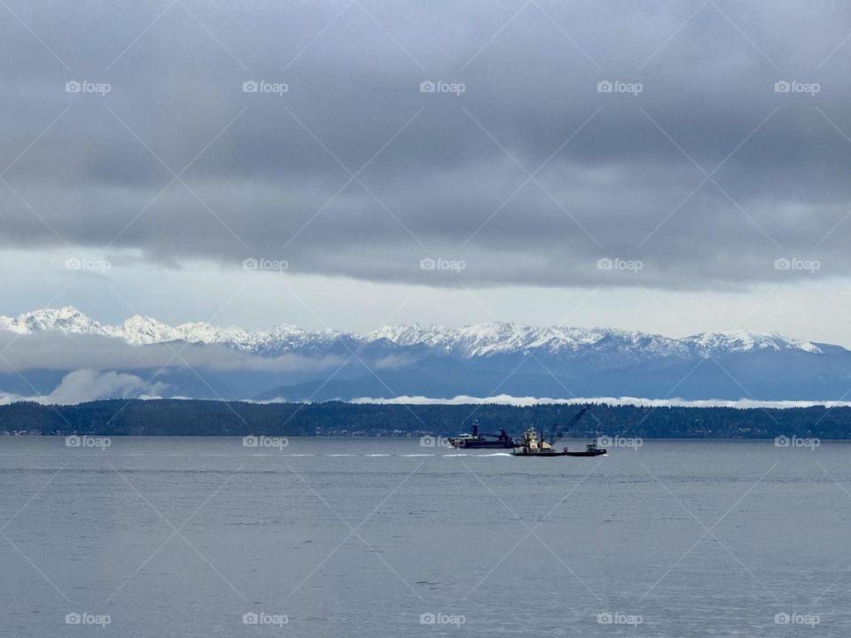 Boat moving near mountains