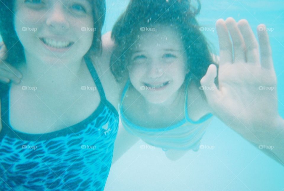 Underwater Cousins. Taken in a pool in Disney World.