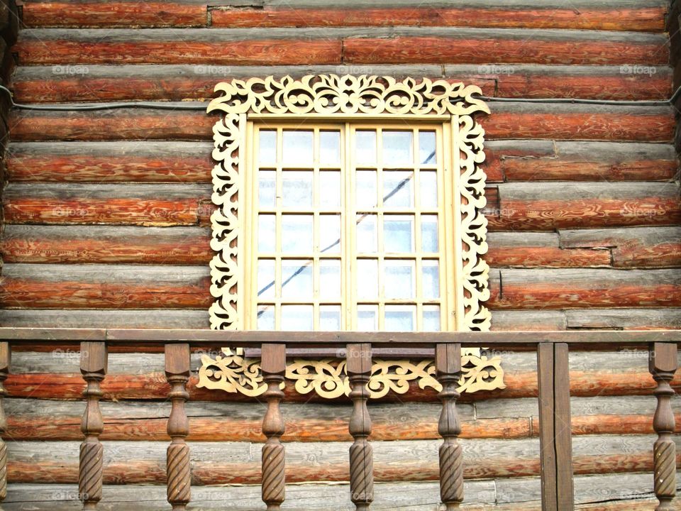 Window with carved frame.