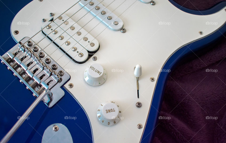 Closeup of a Midnight Blue Electric Guitar
