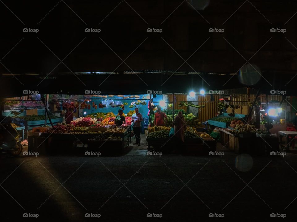Night view of a traditional store by street. Long exposure, blured and defocused