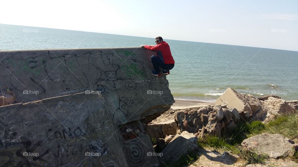 Man climbing on the ruins