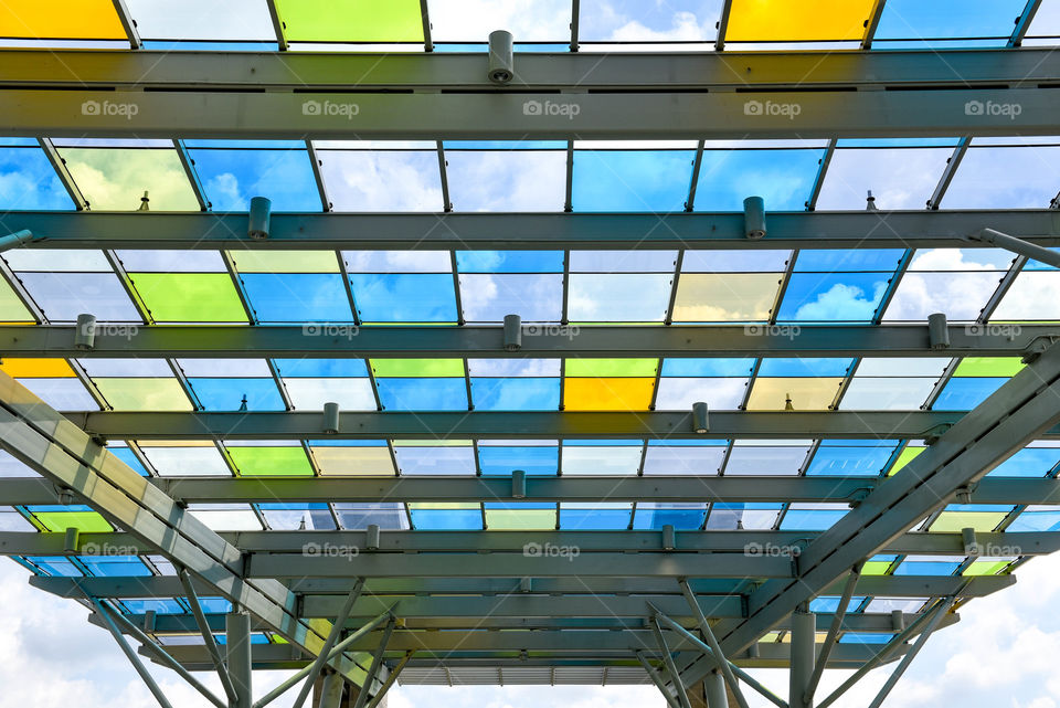 Colorful square glass panels against the bright blue sky