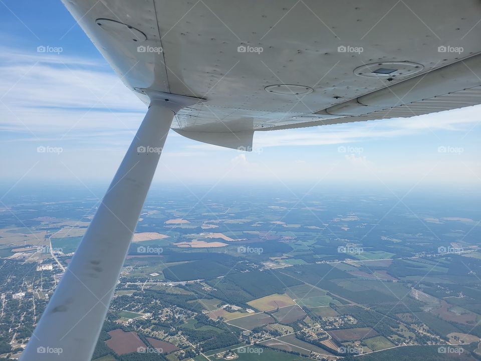 The joy of soaring high above the ground in a single engine plane