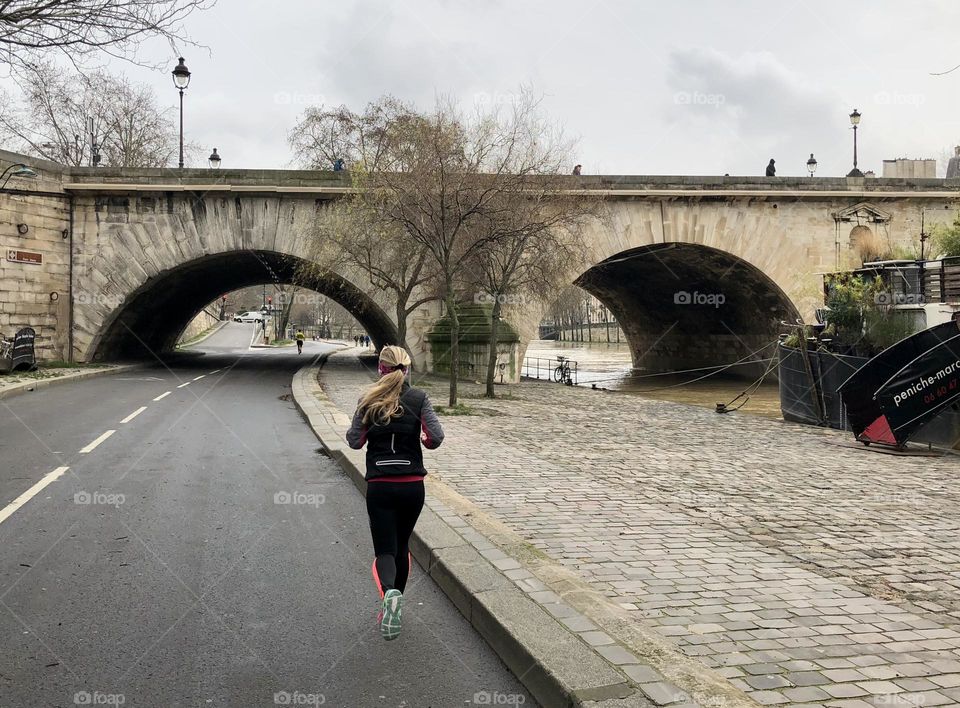 Woman runs in the city 