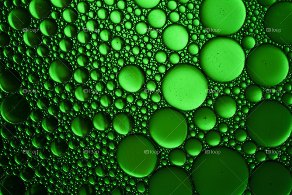 Abstract background of green oil bubbles