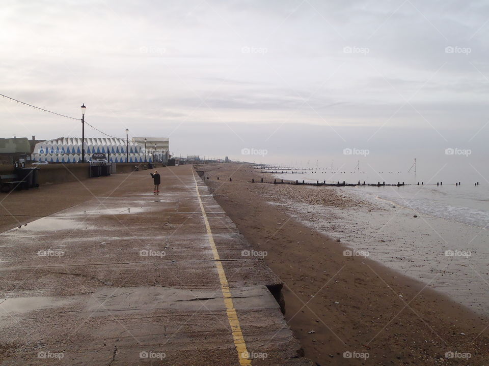 Boy standing on pier