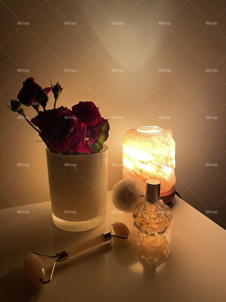 Jade roller and perfume are beauty tools