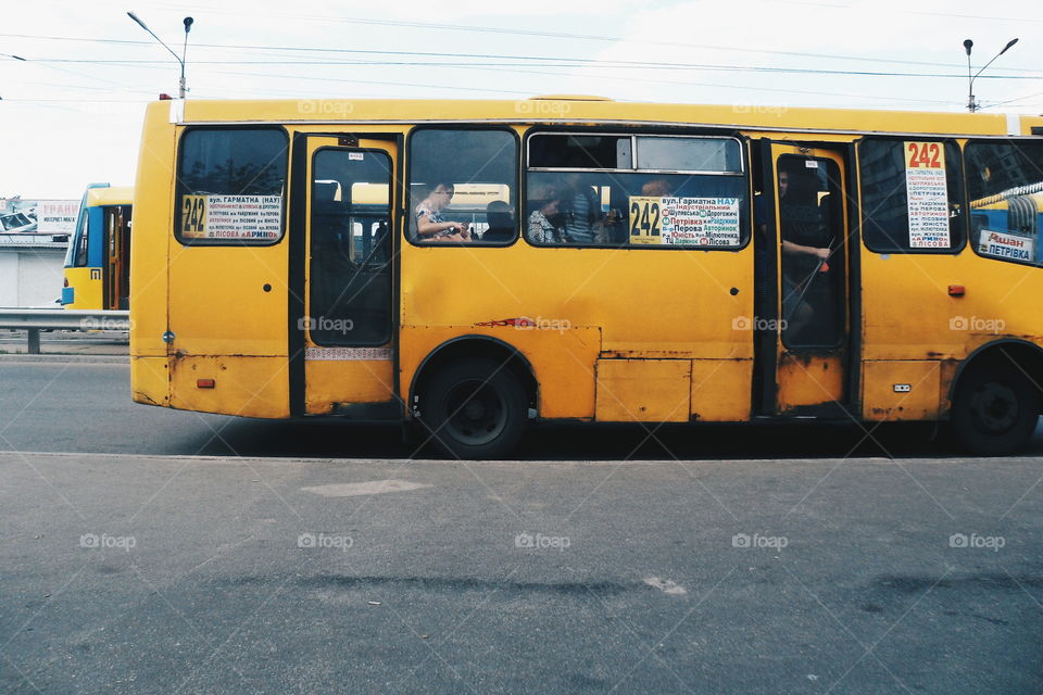 old yellow minibus is at a stop, the city of Kiev