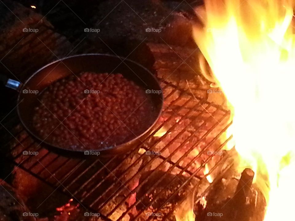 cooking on a campfire. reminds me of blazing saddles