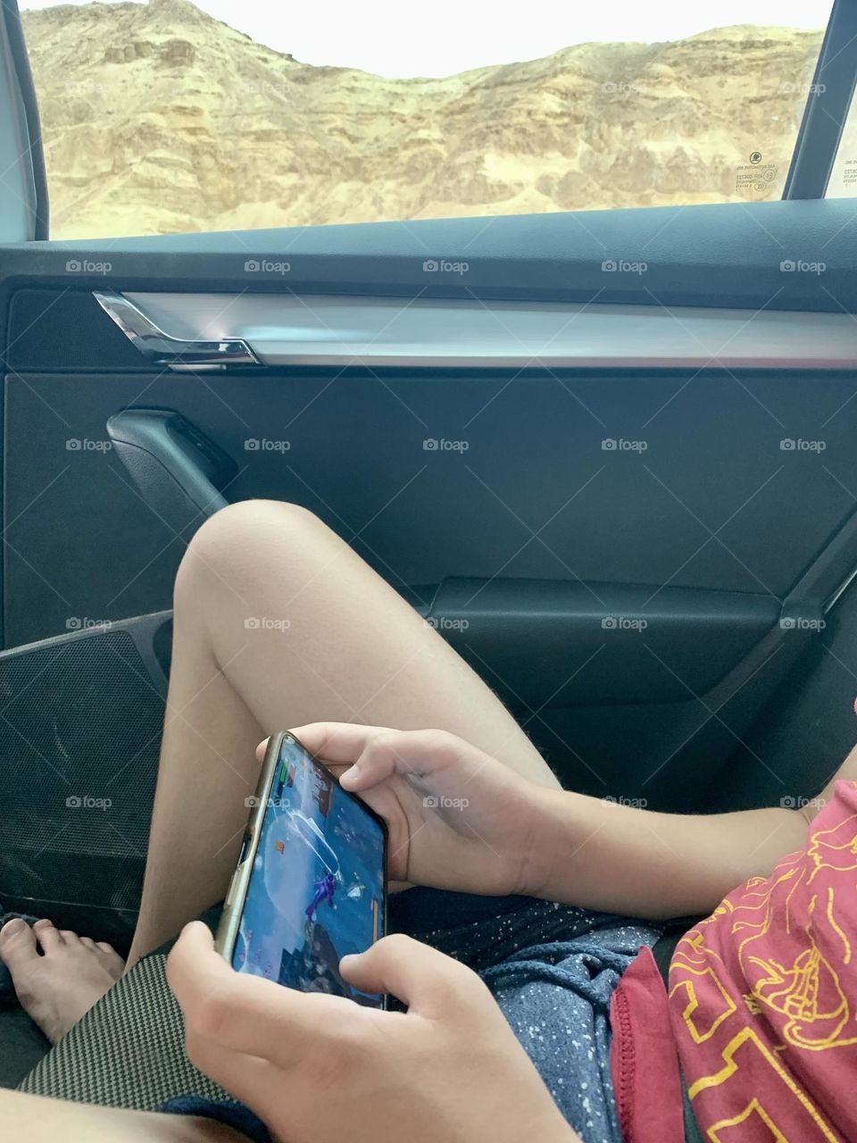 Playing video games on the back seat of the car