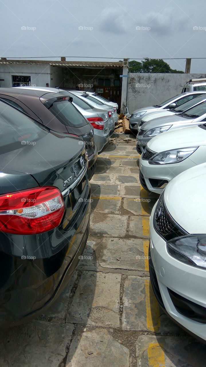 many colourful cars in parking