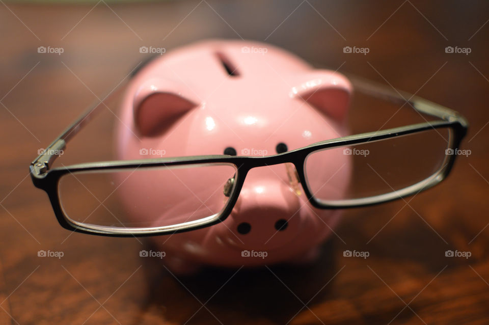Pig bank using glasses