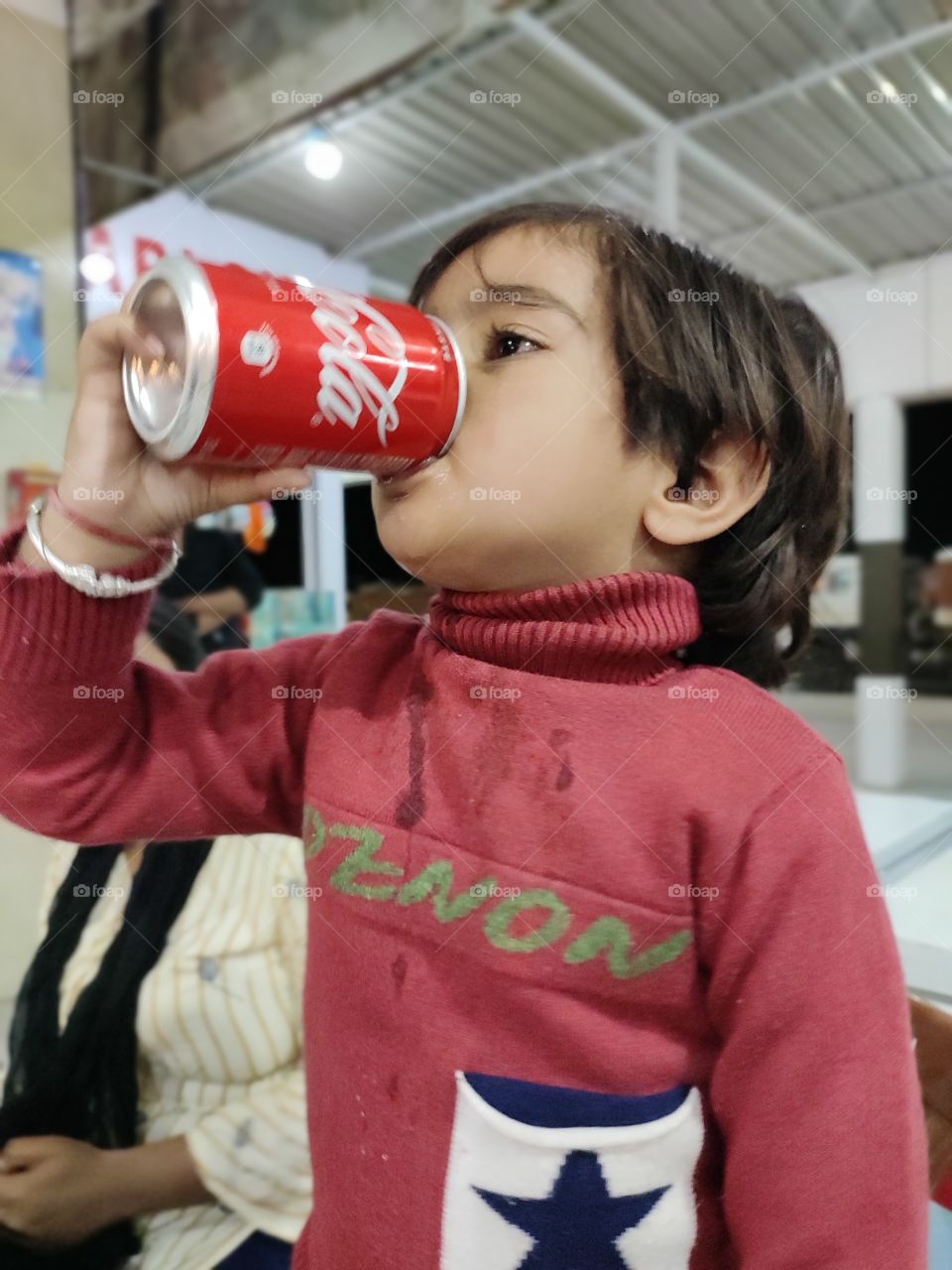 baby girl drinking cocacola