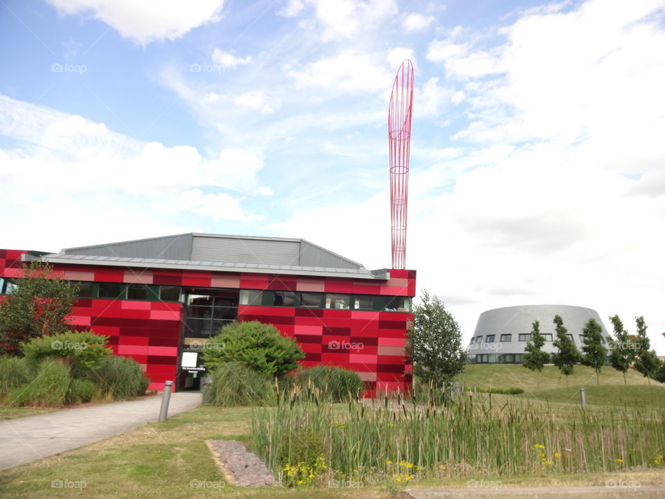 modern architecture. Jubilee Campus , Juniversity of Nottingham with The tall red torch .