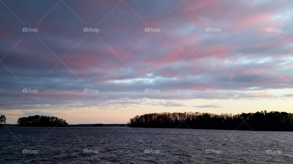 island view during dusk with pink blue clouds.