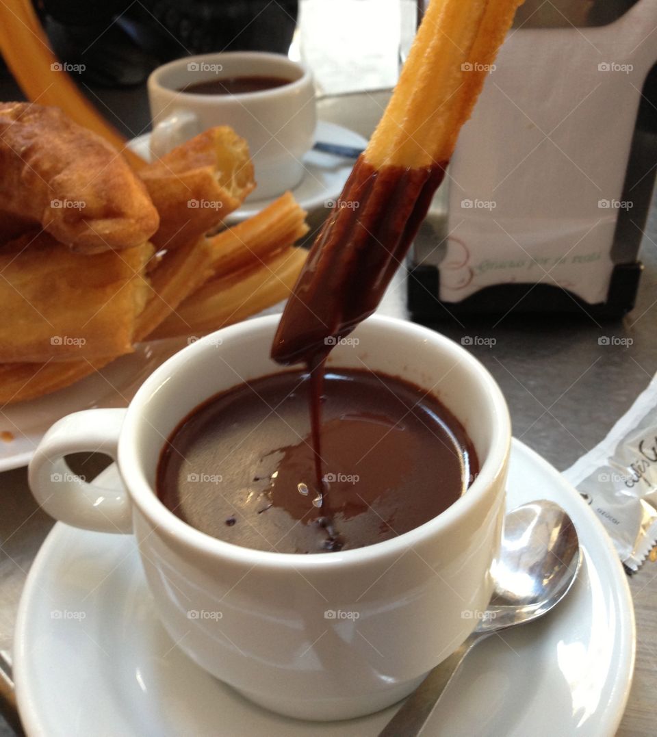 Churros, hot and crunchy outside and tender inside dipped in thick, rich, decadent hot chocolate.  